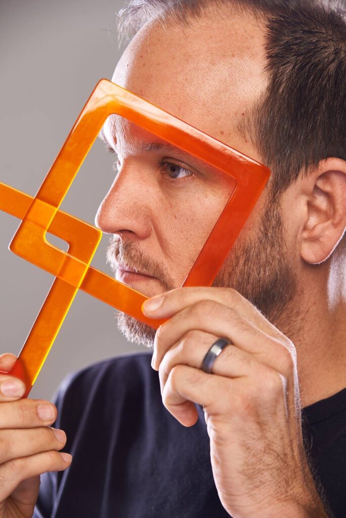 Bradford Mumpower headshot with orange squares